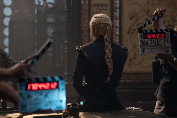 Emma D'Arcy on set of House of the Dragons season three with her back to the camera showing off her intricately braided...